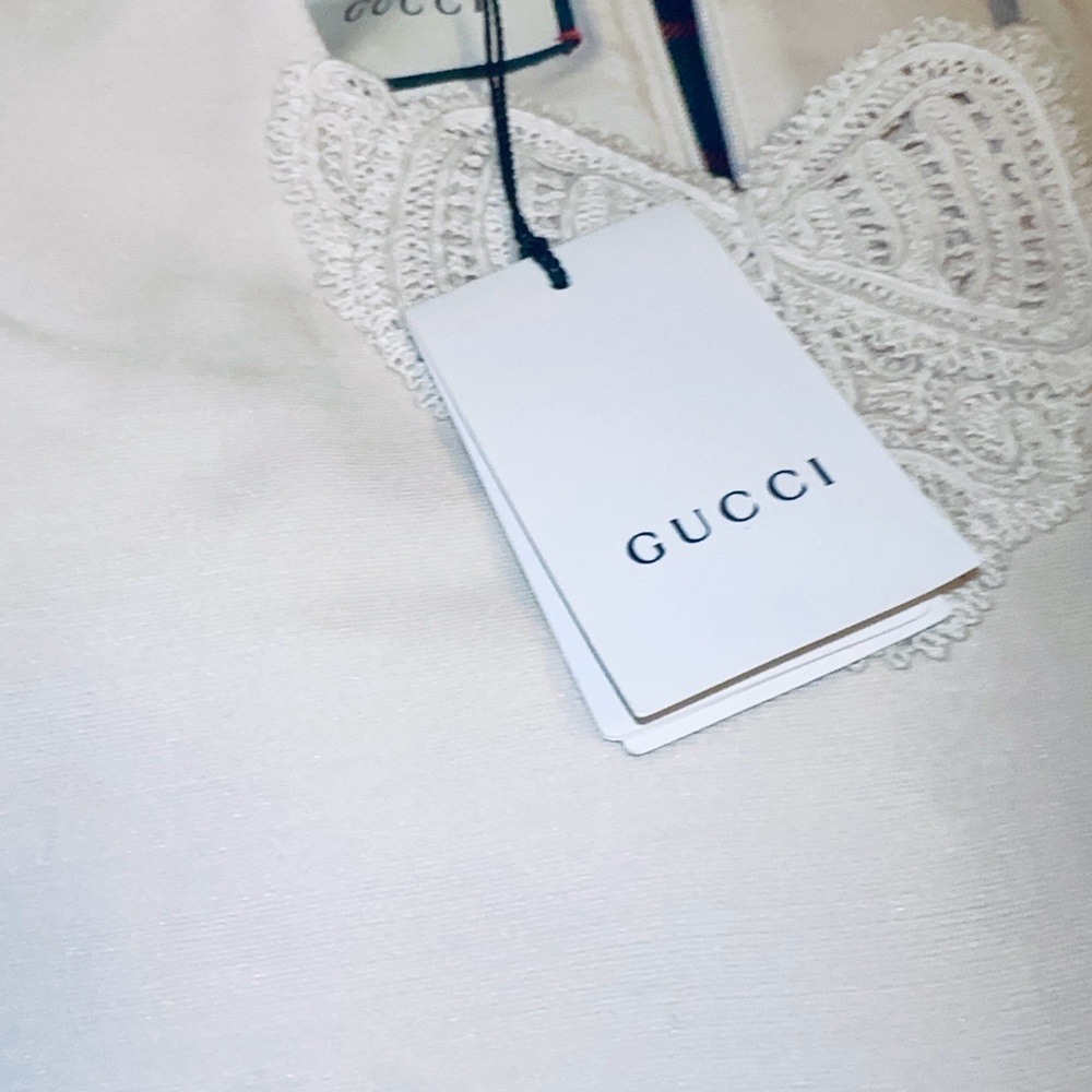 Gucci Red, Crème and Black Asymmetrical Dress with Gucci ivory dress cover. - Picture 12 of 15